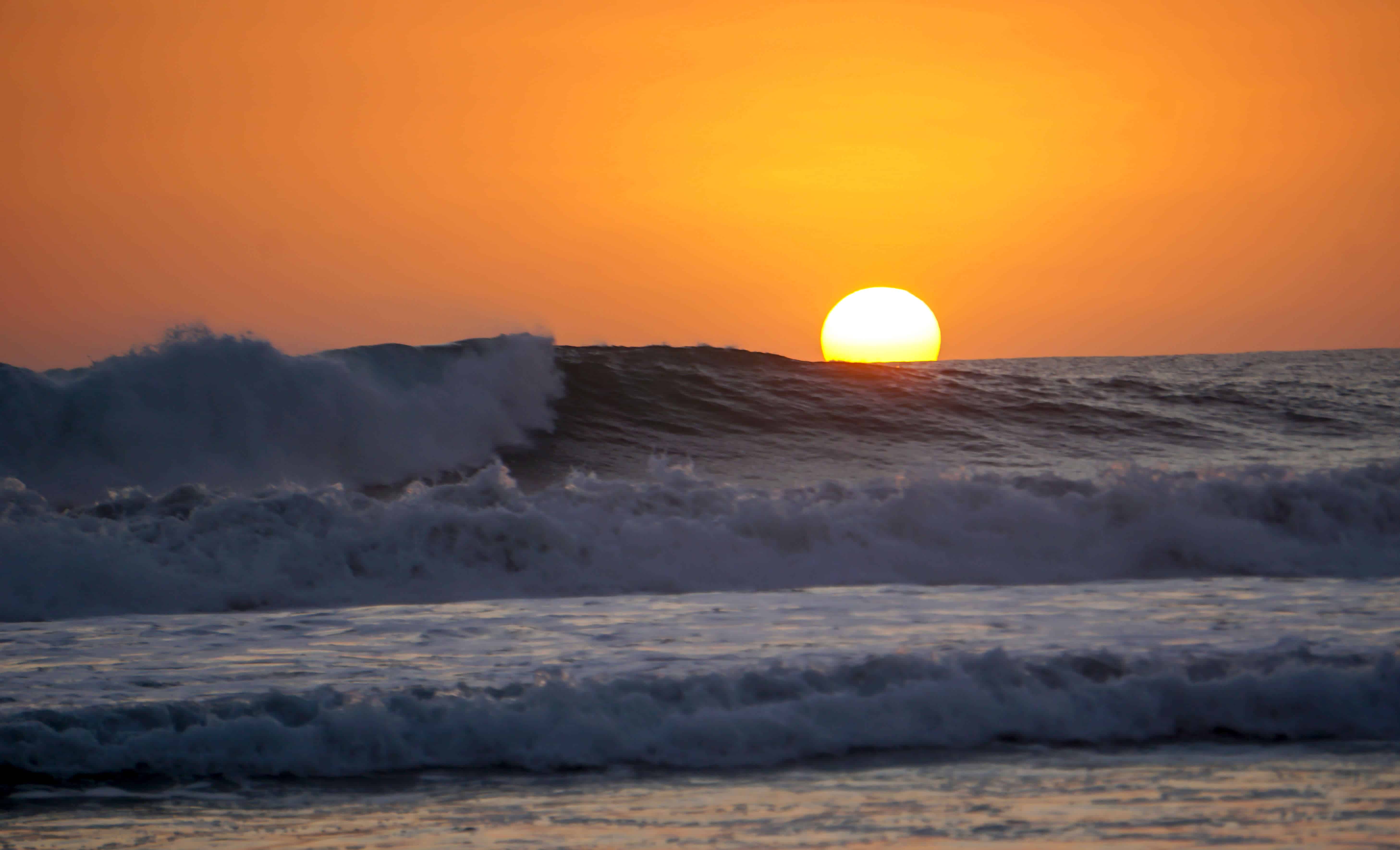 Sunset over the waves in Santa Teresa