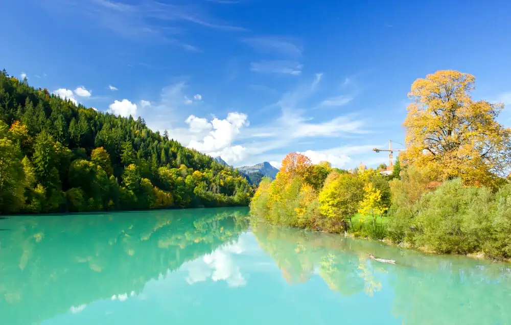 turquoise lake with fall colors