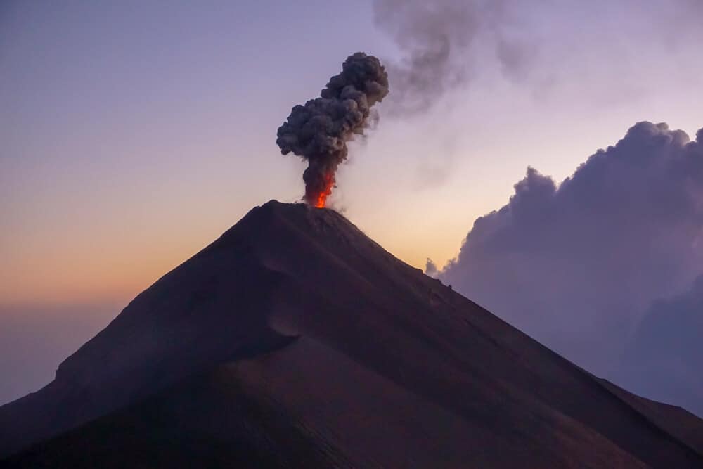 fuego volcano erupting at sunrise