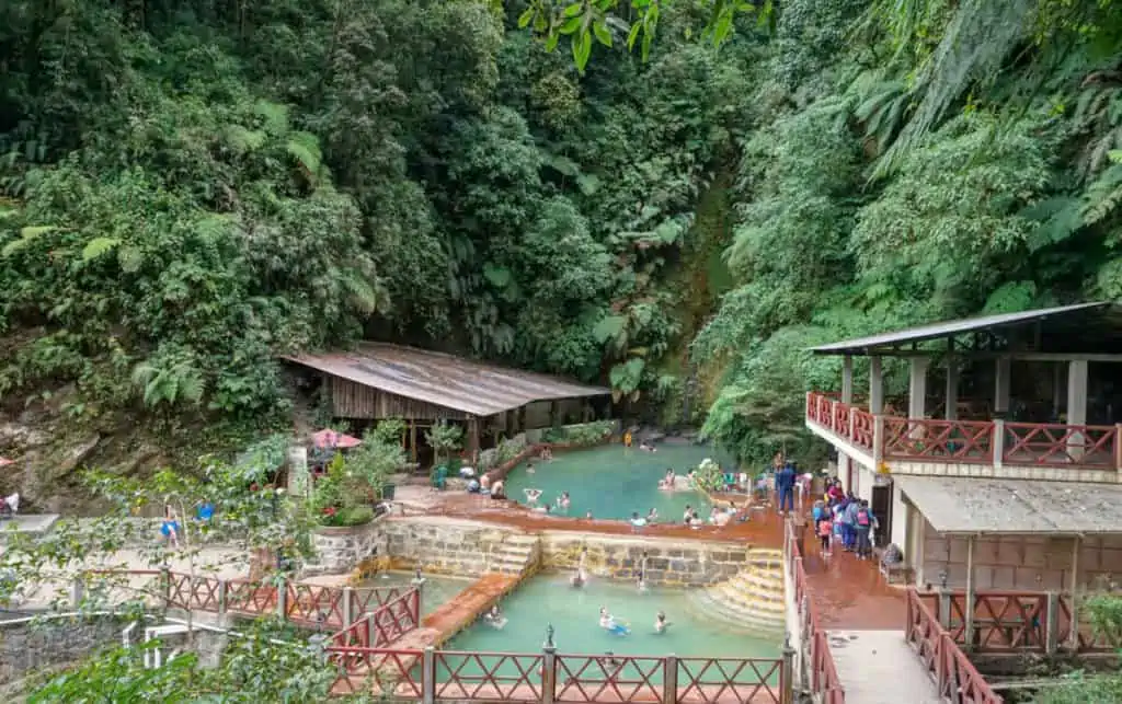 people bathing in the Fuentes Georginas hot springs