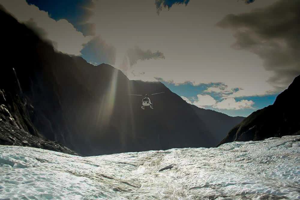 helicopter coming onto glacier