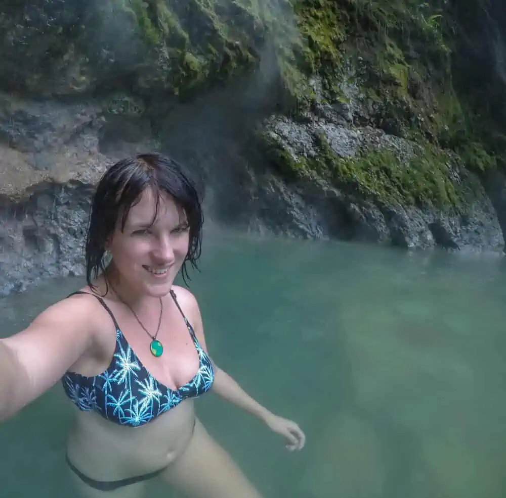 lora smiling while taking a selfie photo in the hot springs