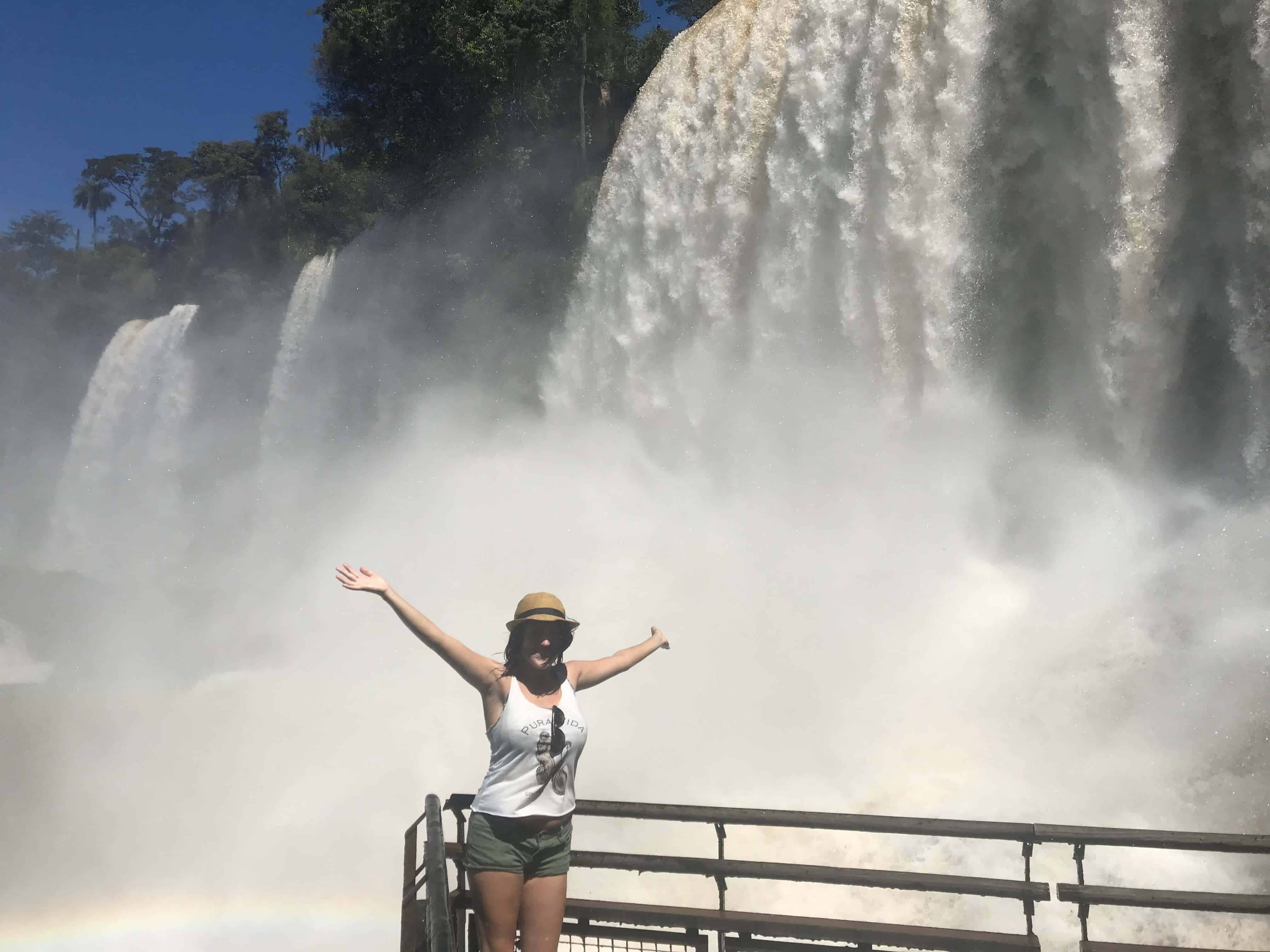 lora in front of iguazu falls