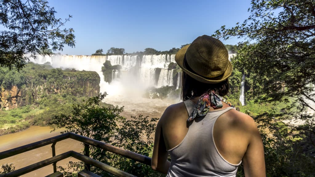 lora looking at iguazu falls