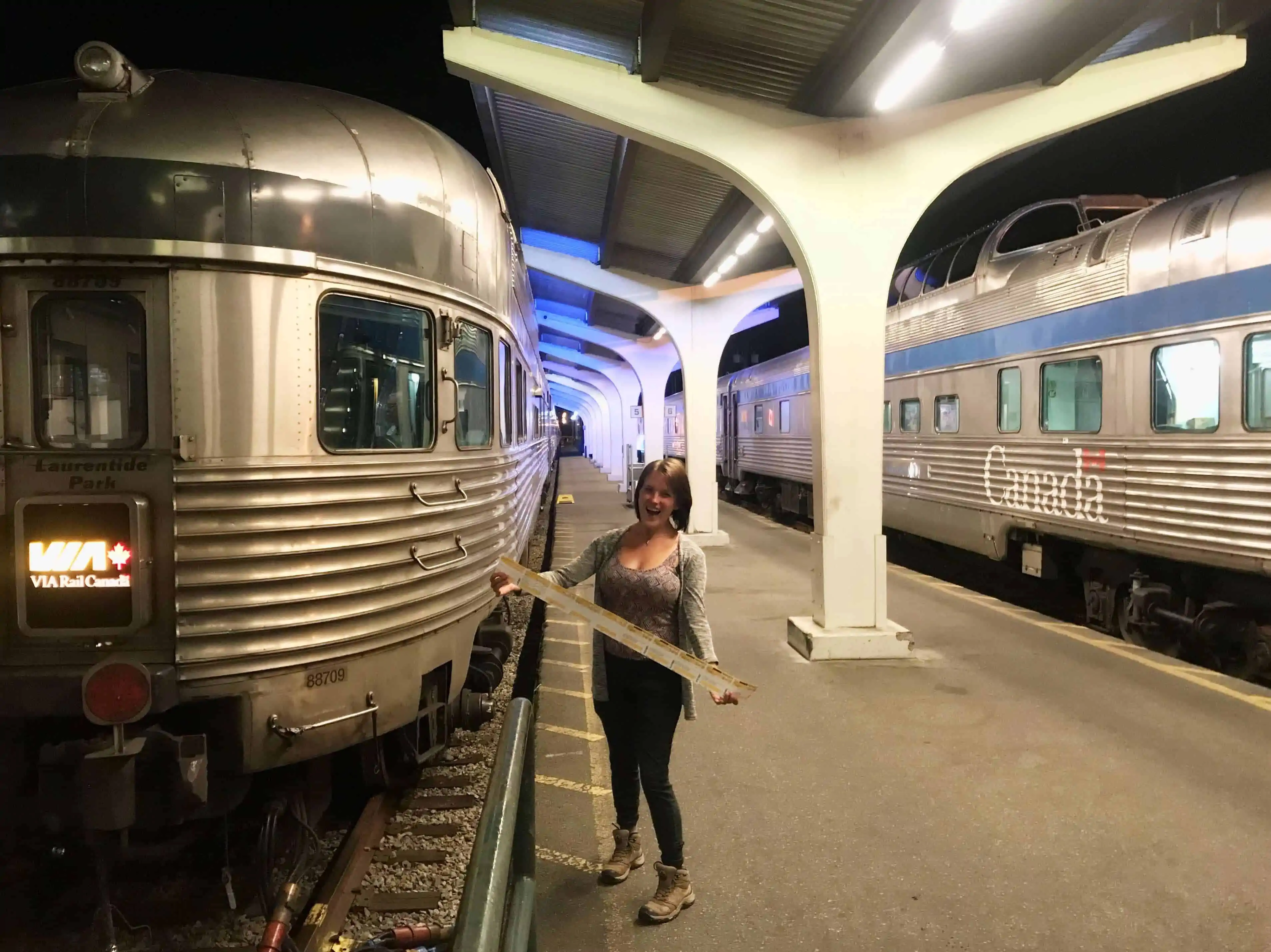 girl holding train tickets in train station downtown vancouver