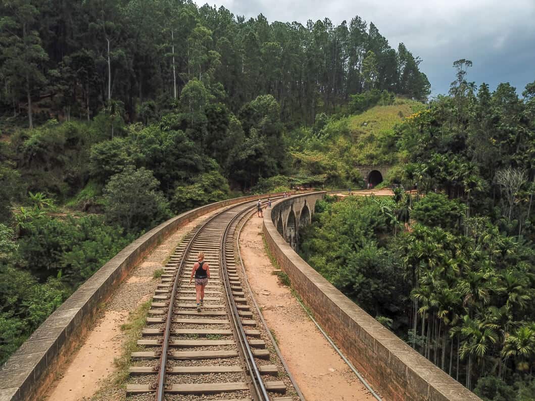 girl Walking along the railway tracks in Ella, Sri Lanka