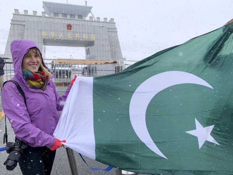 Holding the Pakistan flag at the Pakistan China BOrder