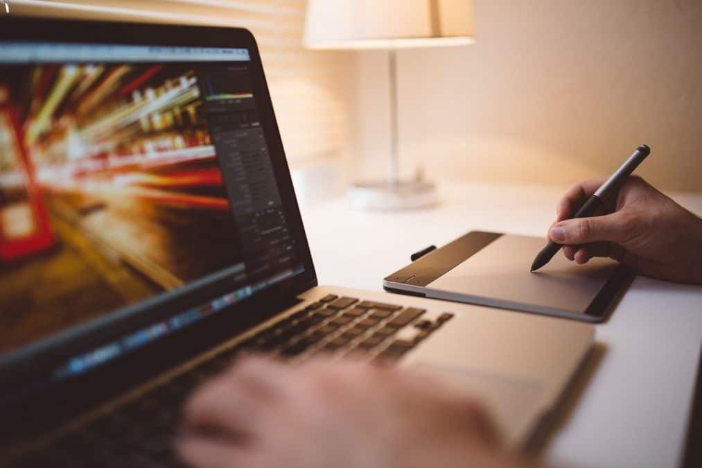 man typing on computer