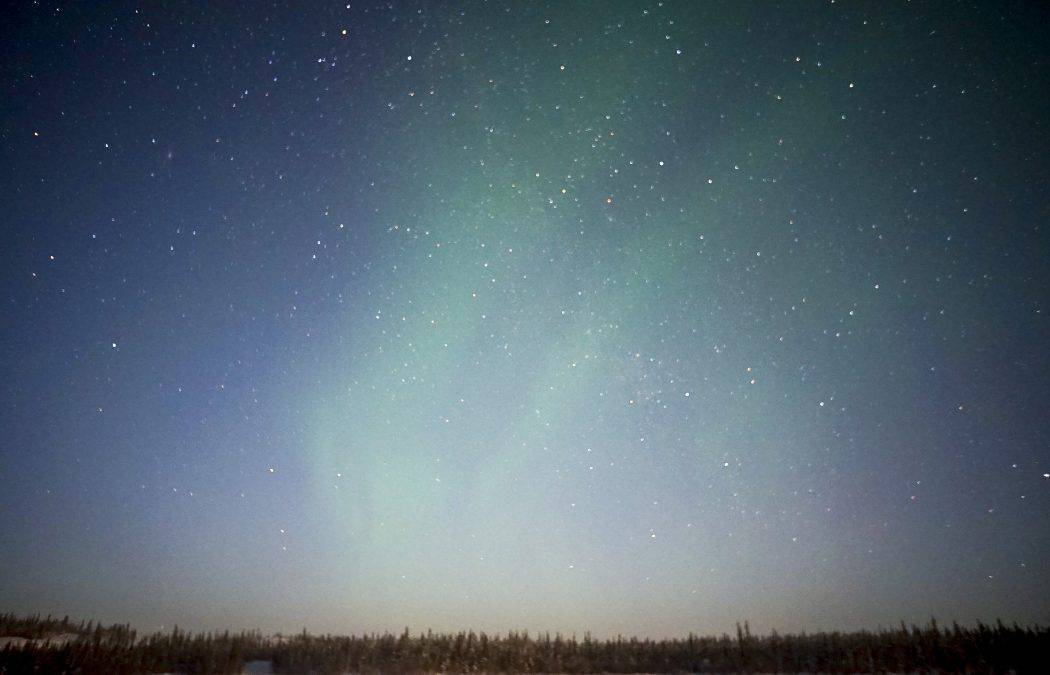 aurora borealis in sky with stars