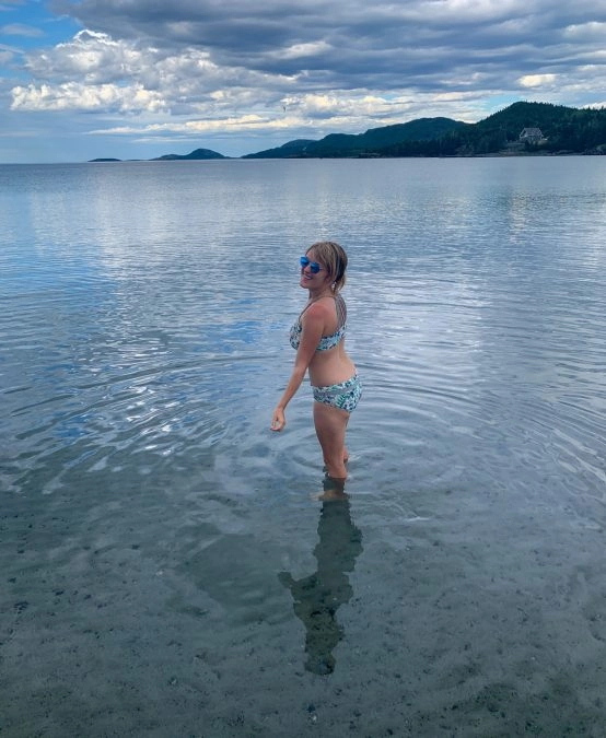 lora swimming in the ocean at the beach in eastport