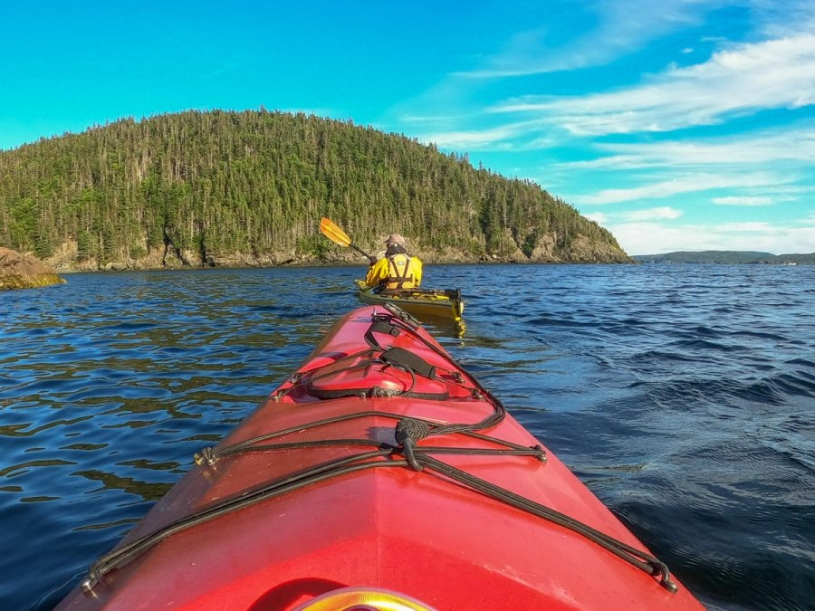 red kayak in ocean  Sea Kayaking around The Bay of Exploits 