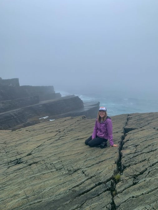 lora sitting on rock in mistaken point