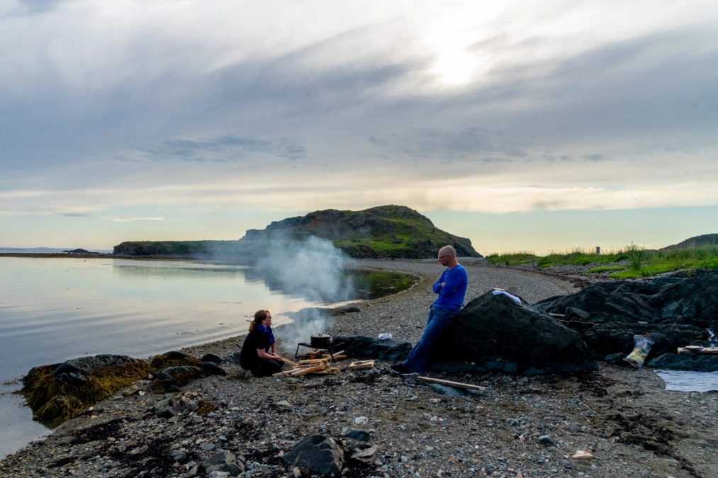 women cooking on a campfire in twillingate newfoundland