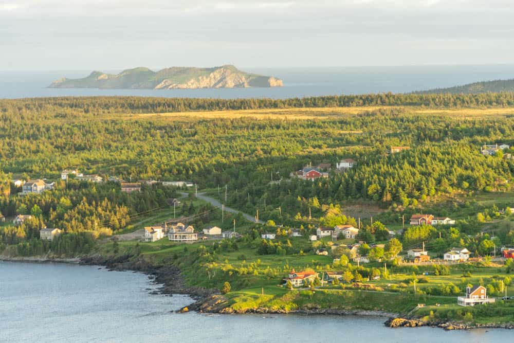 witless bay at sunset with the ecological reserve in the background