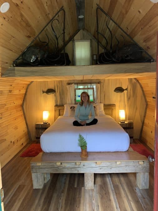 girl on bed in cabin