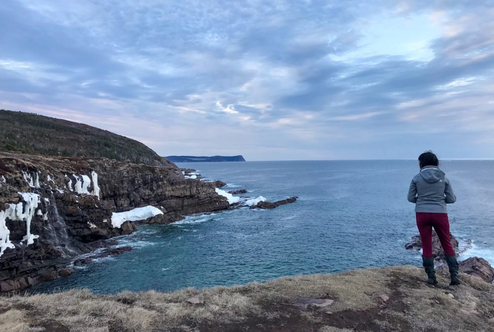 lora looking out at the atlantic ocean on the blackhead path hiking trails