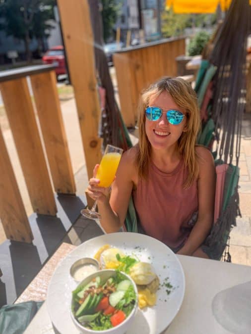 girl drinking juice with salad