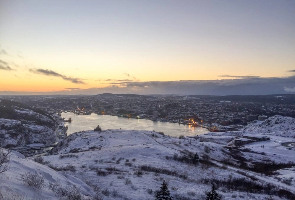 view of st johns at sunset over st johns narrows from the top of signal hill hiking trails