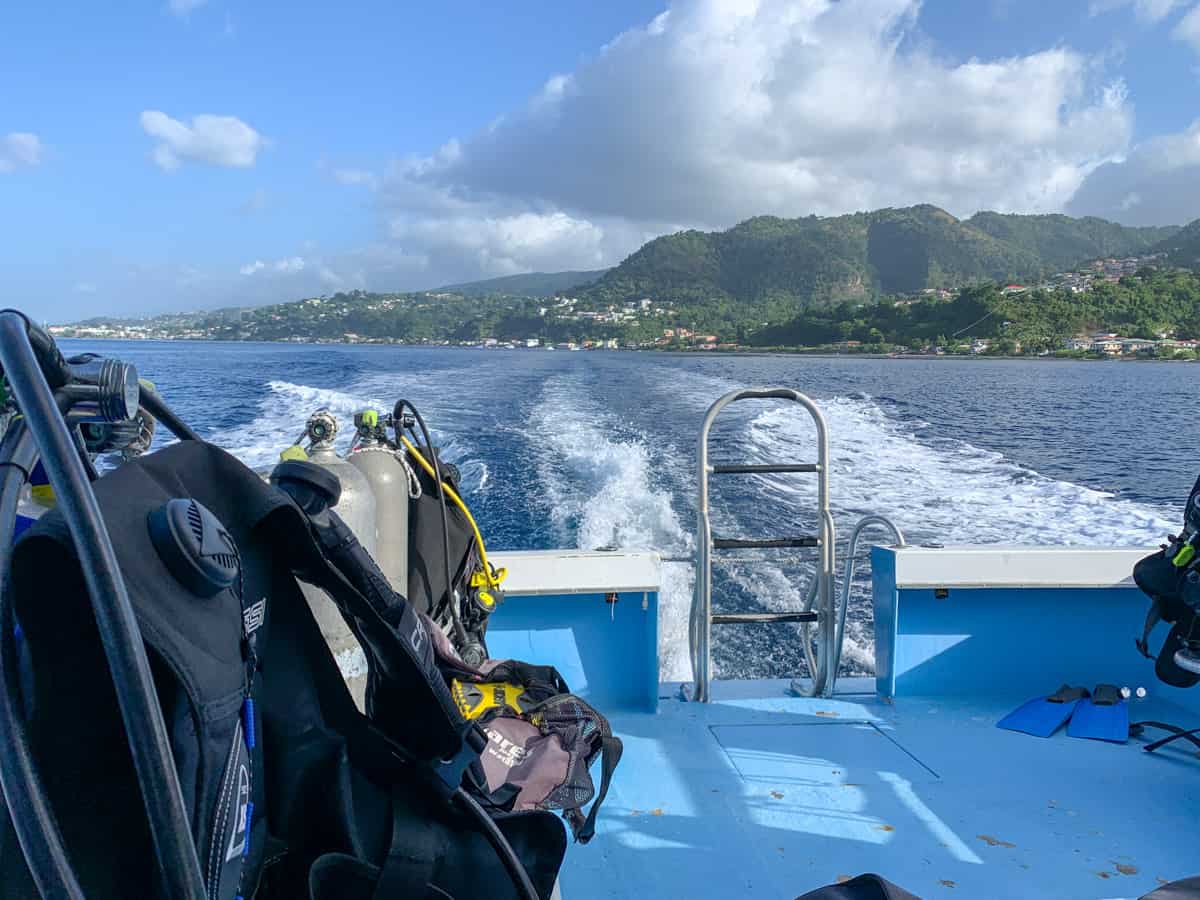 view from back of boat while going to dive site. ocean and mountains.