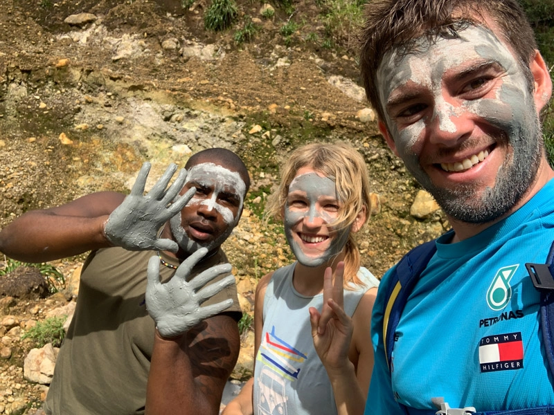 lora, friend. and guide taking a selfie with clay facials on the boiling lake hike dominica