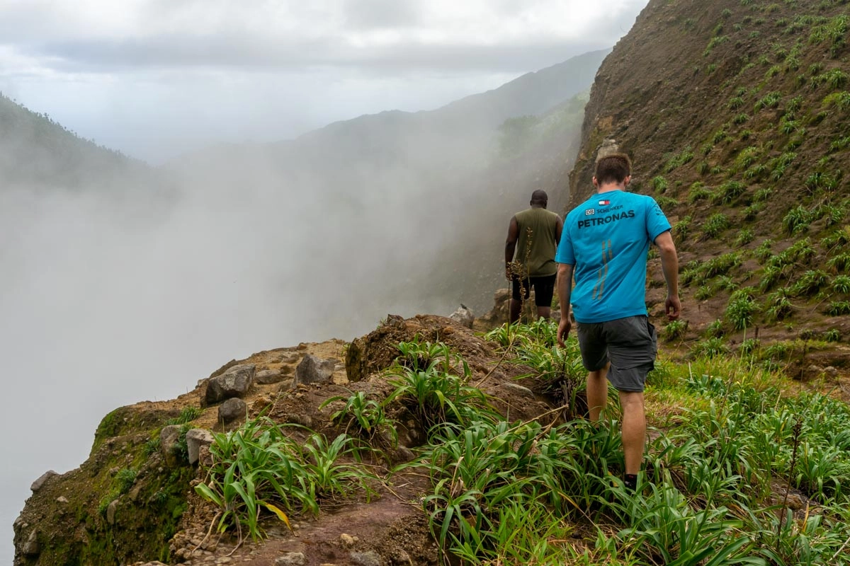 two guys walking towards boiling lake dominica