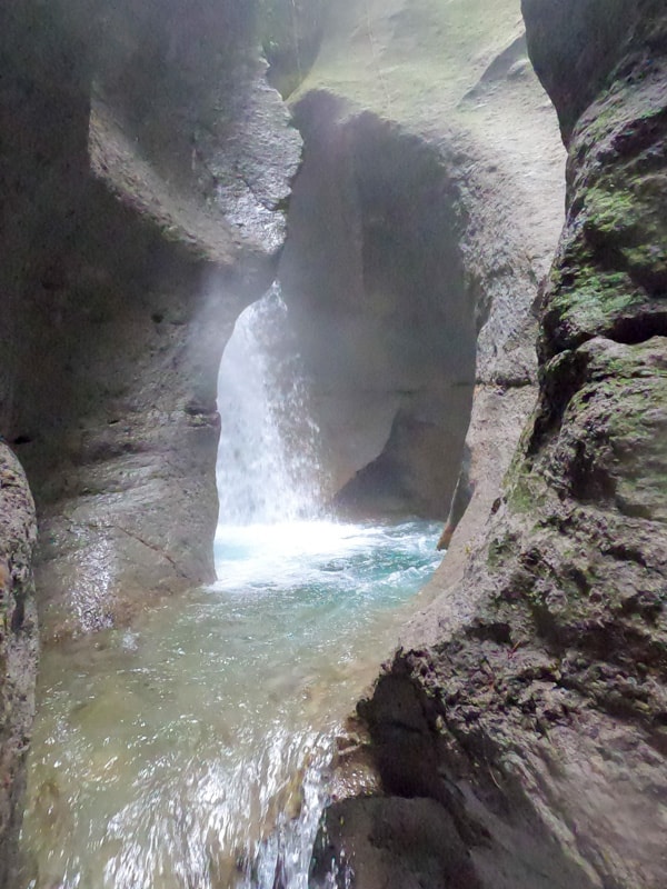 waterfall flowing down titou gorge dominica