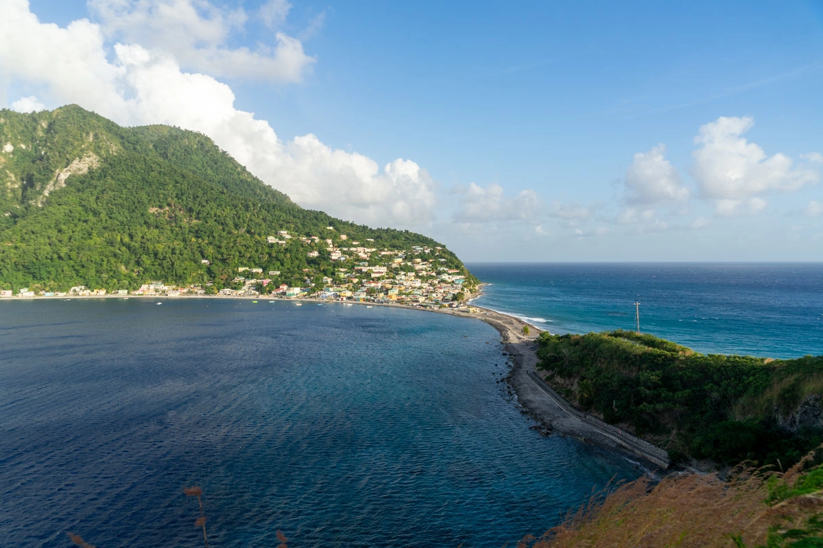 view of atlantic ocean and caribbean sea meeting at scott's head viewpoint hike in dominica