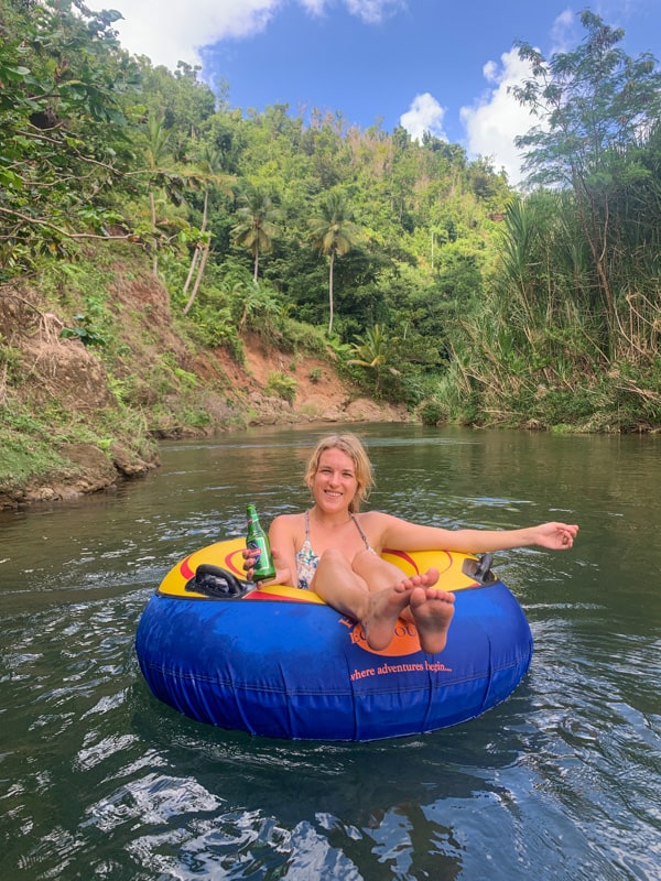 lora in a tube floating down a river in dominica