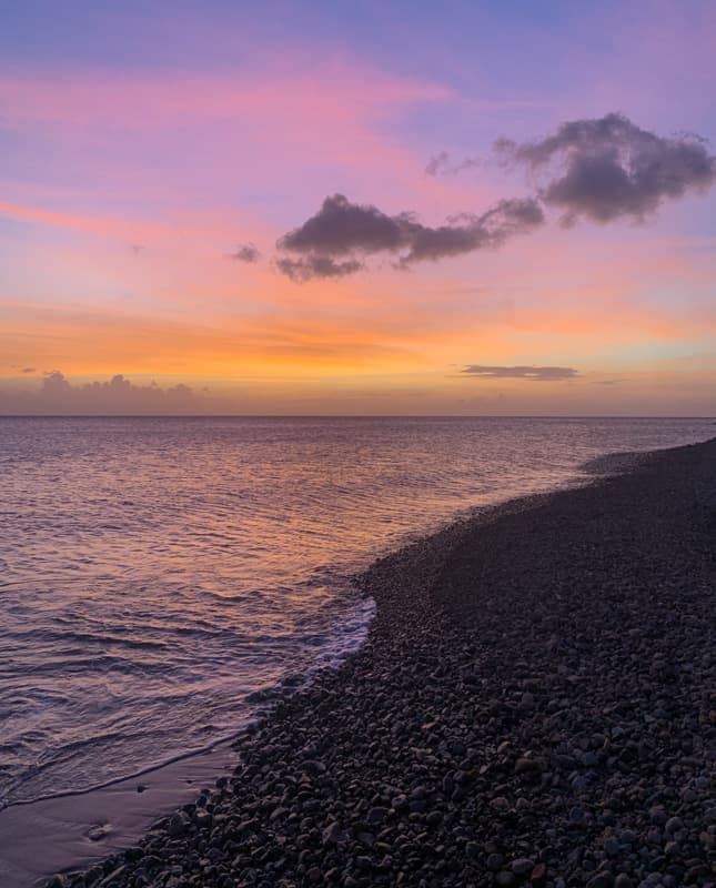 a purple and yellow sunset at soufriere bay indominica