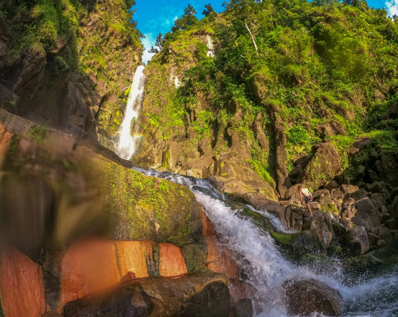 trafalgar falls in dominica with lush green around