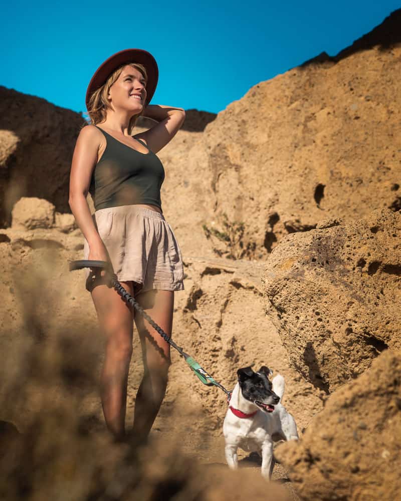 girl hiking with dog