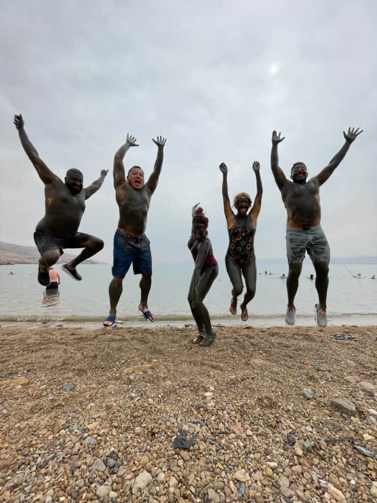 group jumping at dead sea