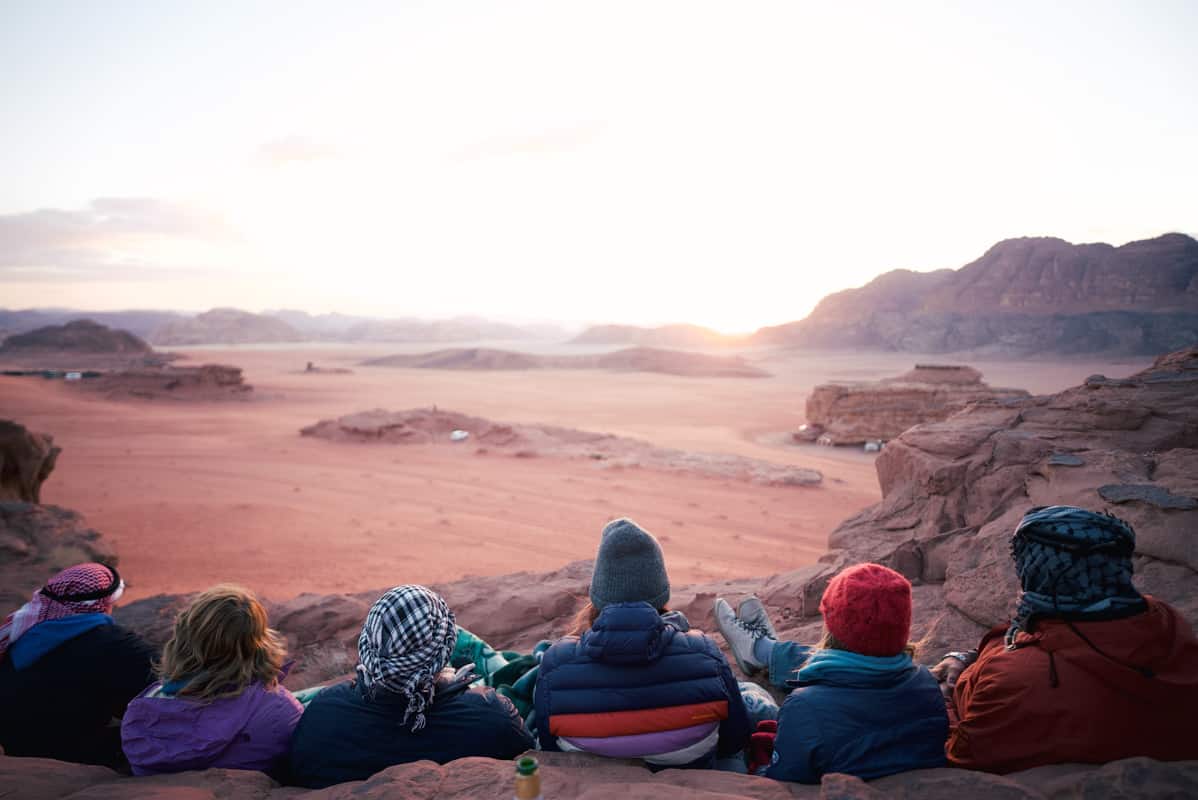 group watching sunset in wadi rum