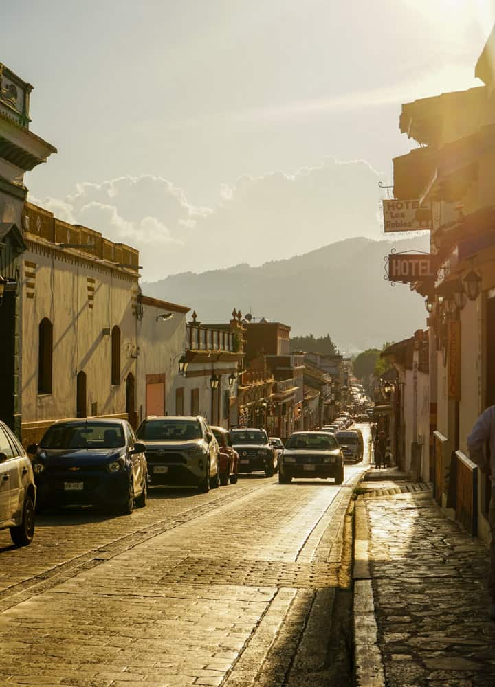 A street with cars parked on it, one of the best places in Mexico for digital nomads.