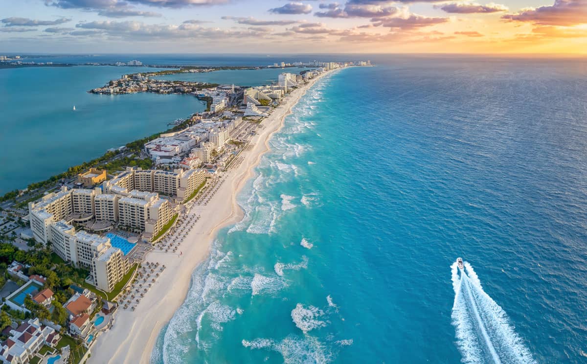 Breathtaking aerial view of a pristine beach and luxurious hotels in Cancun, Mexico