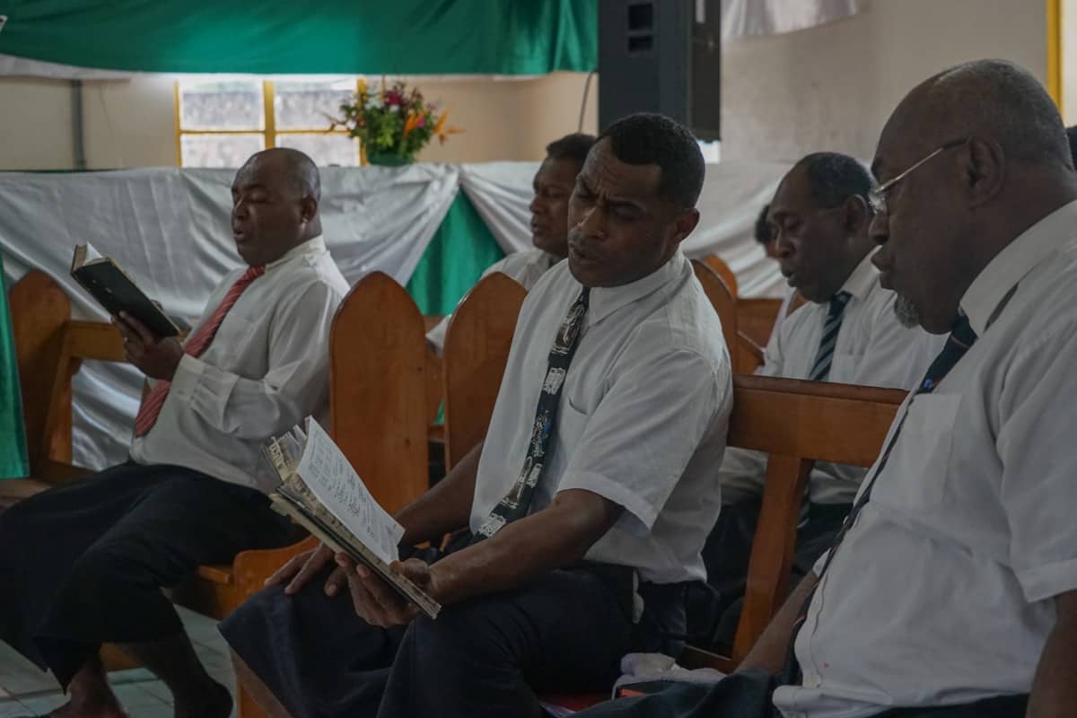 fijian men singing in church