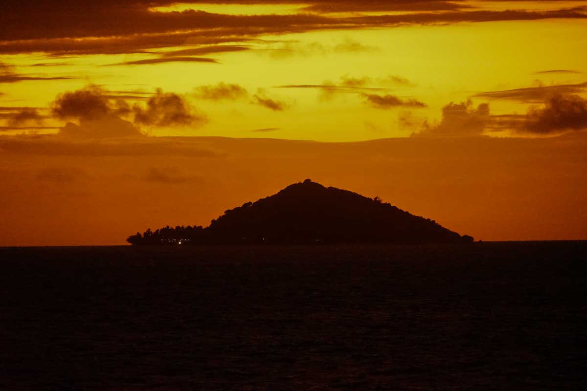yellow and orange sunset over island in Fiji