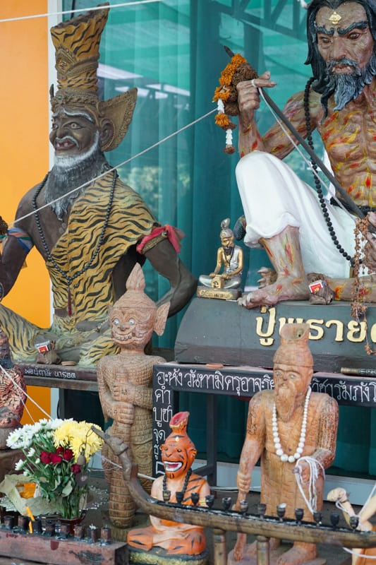 buddhist ornaments outside a tattoo studio in thailand