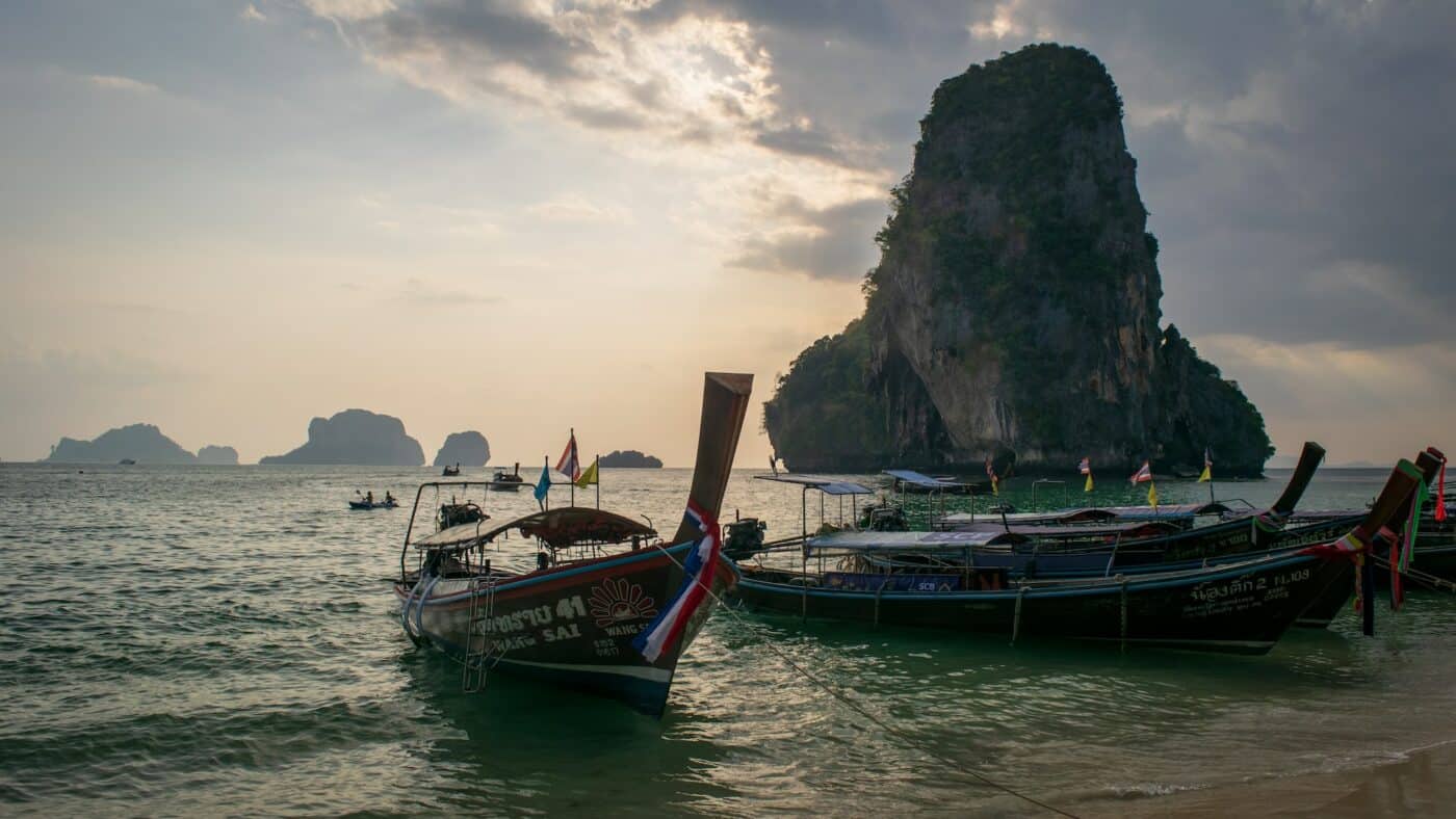boats in water during sunset at Railay Beach