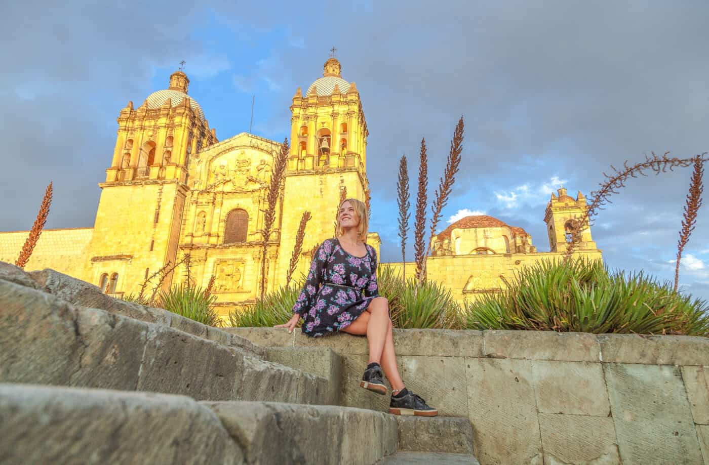 lora sitting in front of church in oaxaca city