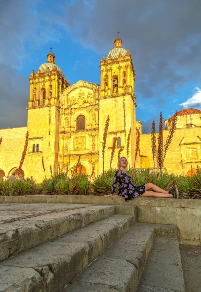 lora by church at sunset in oaxaca mexico