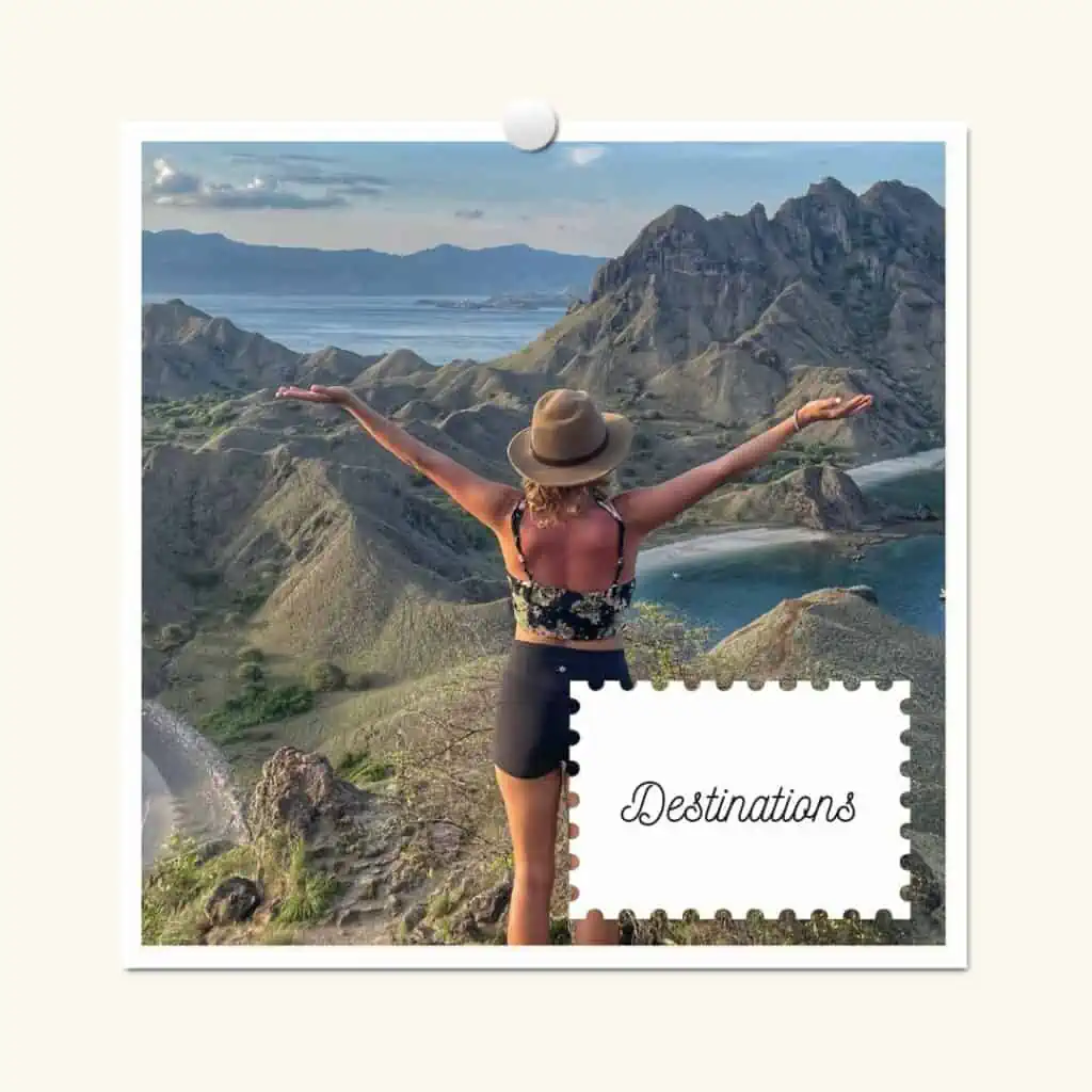 lora from behind with her arms out looking over a beautiful mountain in the komodo islands in indonesia. the overlay text reads destinations