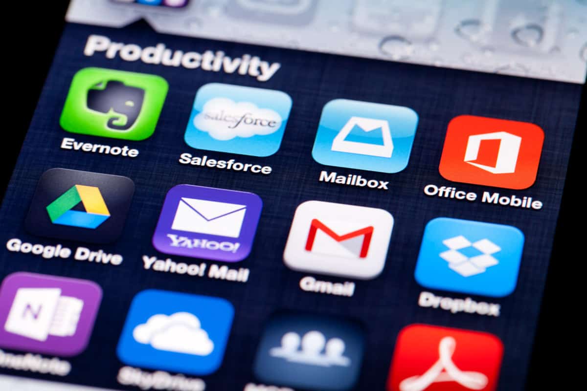 close-up image of an iPhone screen with icons of productivity apps