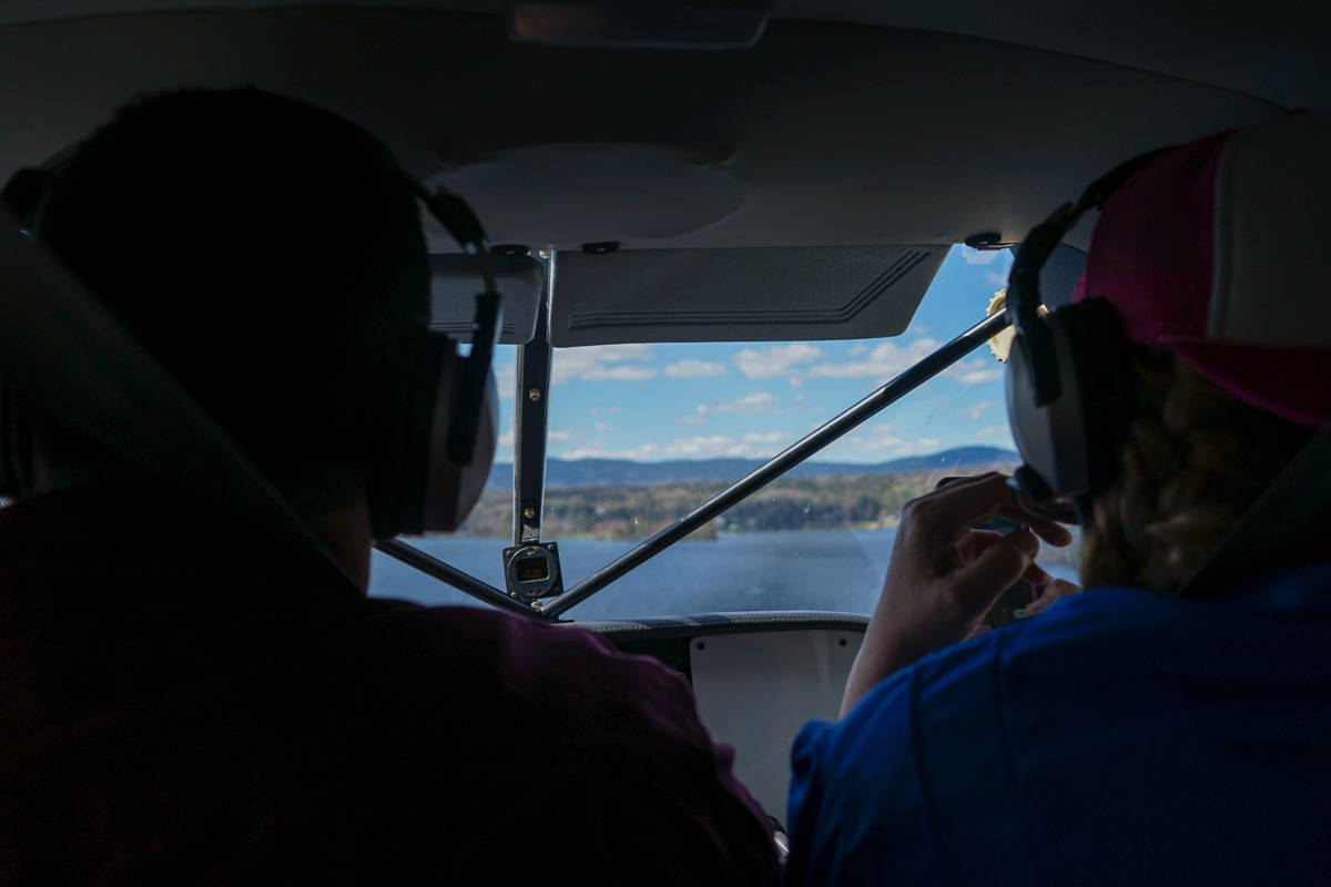 two people watching the front of a seaplane window