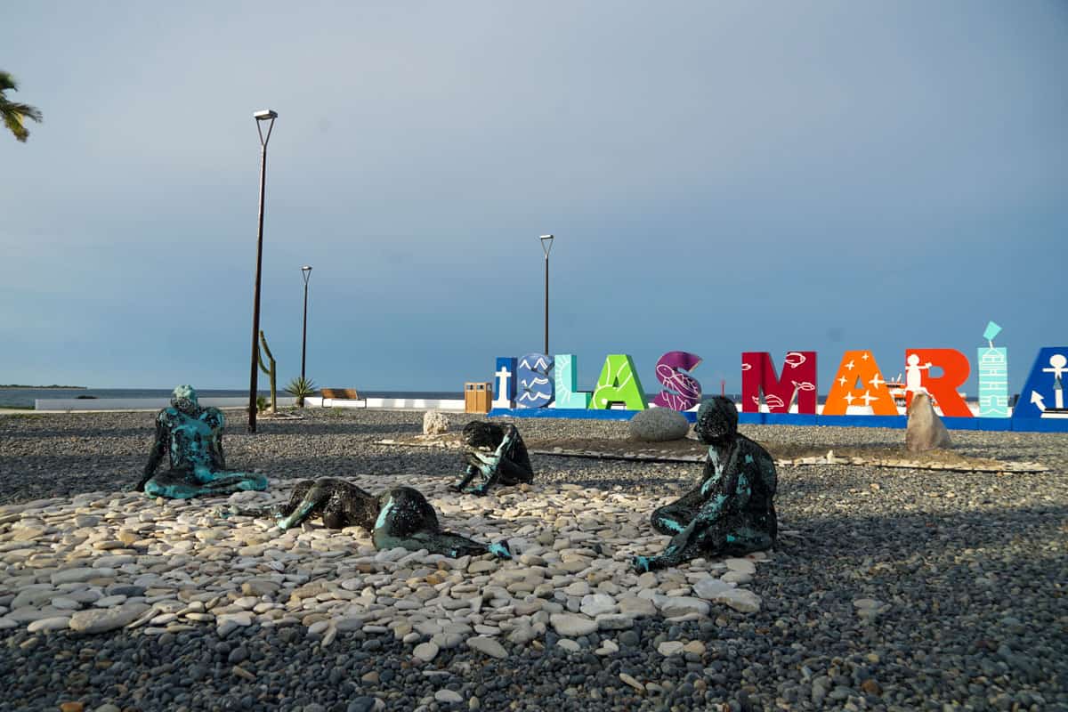 artwork of four people in front of islas marias sign