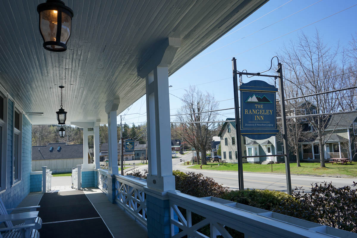 front balcony of the rangeley inn on a bright and sunny day