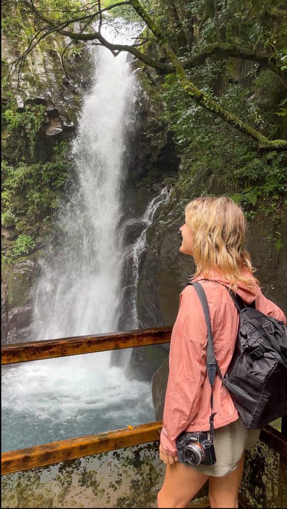 lora looking at waterfall