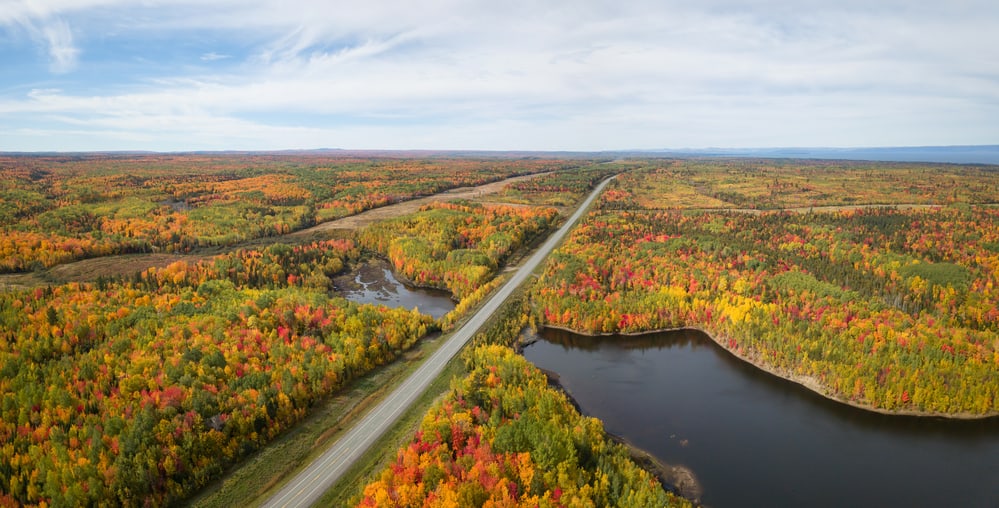 An aerial view of an east coast Canada highway in the fall.