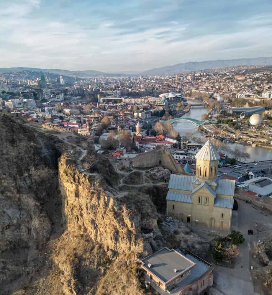 An aerial view of the city of yerevan from the top of a cliff.