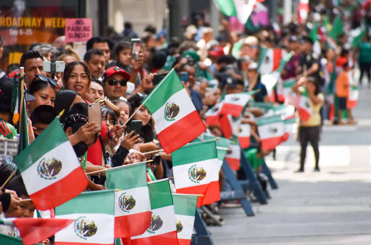 mexican waving flags during a mexican independence day parade